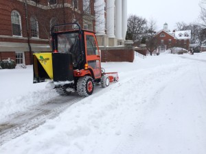 Tractor clears snow in front of Alumnae Hall.